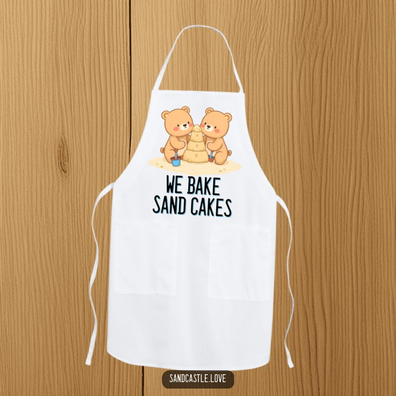 Funny apron showing two charming bears with miniature shovels and buckets, busy building a sandcastle, ideal for kitchen tasks and beach-themed fun.