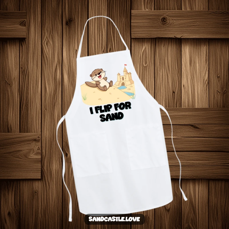 Funny apron depicting a joyful otter character sliding down a sandy hill towards a sandcastle moat, perfect for kitchen activities and beach-themed parties.