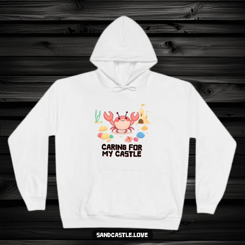 Funny hoodie featuring a joyful crab character carrying a bounty of colorful seashells towards a sandcastle, symbolizing a successful beachcombing trip.
