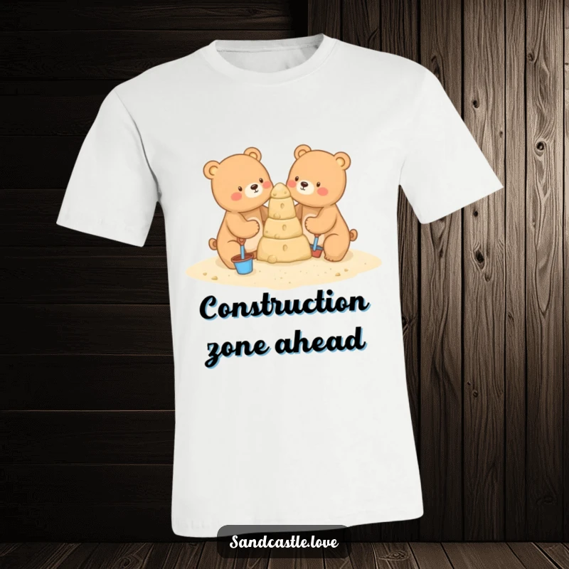 Funny t-shirt showing two charming bears with tiny tools constructing an impressive sandcastle, capturing a sweet moment of collaborative beach play.
