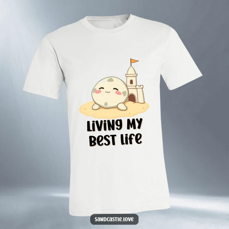 Funny sand dollar t-shirt, a contented character resting on warm sand beside a sandcastle, beach relaxation gift.