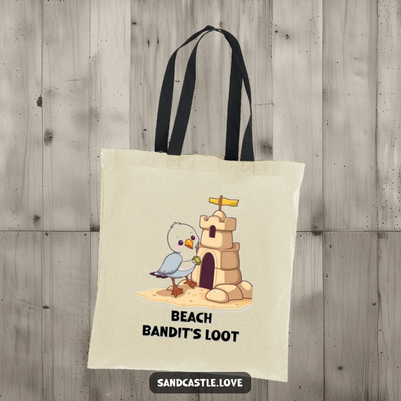 Funny seagull tote bag, a mischievous seagull snatching a shiny object from a sandcastle, beach accessory gift.